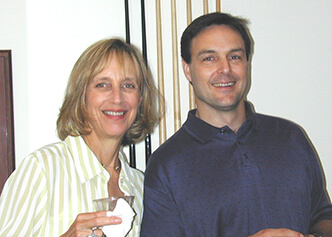 DCRI staff Marelle Molbert and Jimmy Melton smile together during an offsite event in 2003.