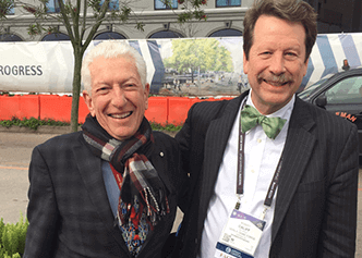 Longtime collaborators Paul Armstrong, of the Canadian VIGOUR Centre, and Rob Califf visit with one another.
