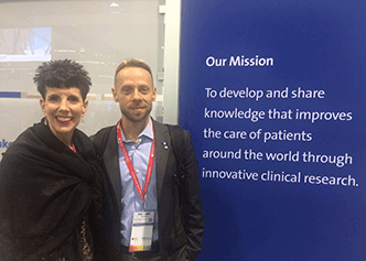 Lynn Perkins and Matt Wilson, both of DCRI's Clinical Events Classification group, gather at the DCRI booth during AHA 2017.