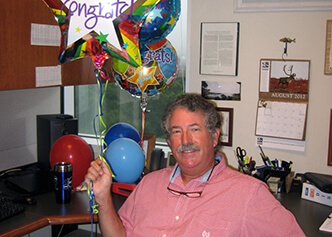 Bernie McCants, shown here celebrating 39 years with the Duke Databank, retired in 2014 after 42 years of service at Duke.
