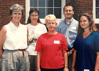 Penny Hodgson, the original director of DCRI Communications, with her team in 1995.