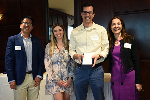 2024 Citizenship Award recipient Ilia Shadrin poses with DCRI Fellowship Program Leadership during an awards ceremony.