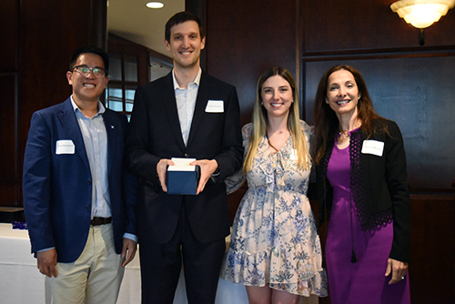 2024 Harrington Award recipient Daniel Guidot poses with DCRI Fellowship Program Leadership during an awards ceremony.