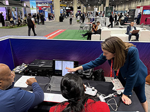 Jennifer Rymer points to the screen during a simulation session with her colleagues at AHA25