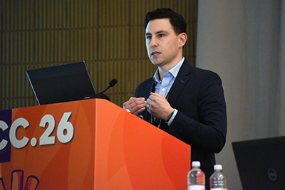 DCRI nephrologist Daniel Edmonston speaks from an ACC.26 podium.