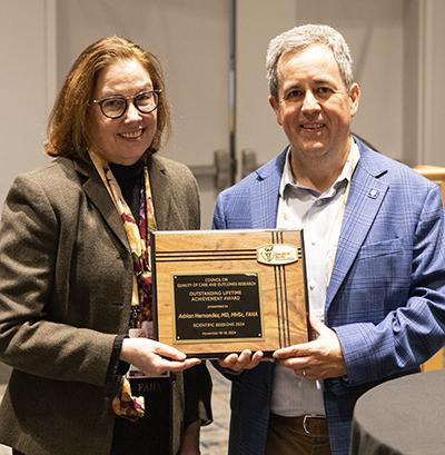 Adrian Hernandez is pictured holding his lifetime achievement award from the QCOR council which was presented to him at AHA2024.