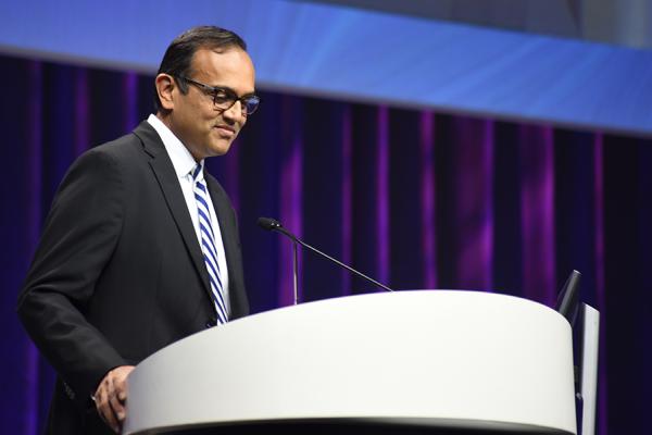 DCRI Faculty Member Manesh Patel stands speaking at a podium at a recent conference.