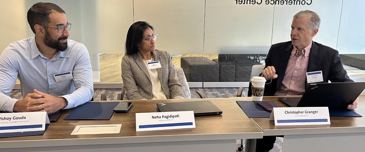 Pishoy Gouda, Neha Pagidipati, and Chris Granger are shown speaking during a meeting of DCRI faculty, and government and industry partners.