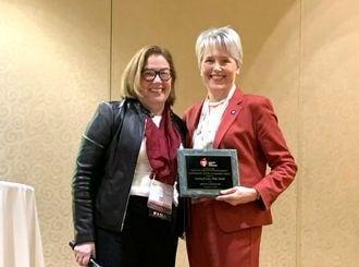 Lesley Curtis receiving award