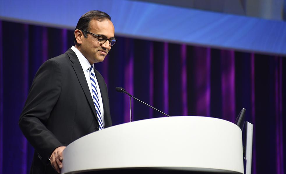 DCRI Faculty Member Manesh Patel stands speaking at a podium at a recent conference.