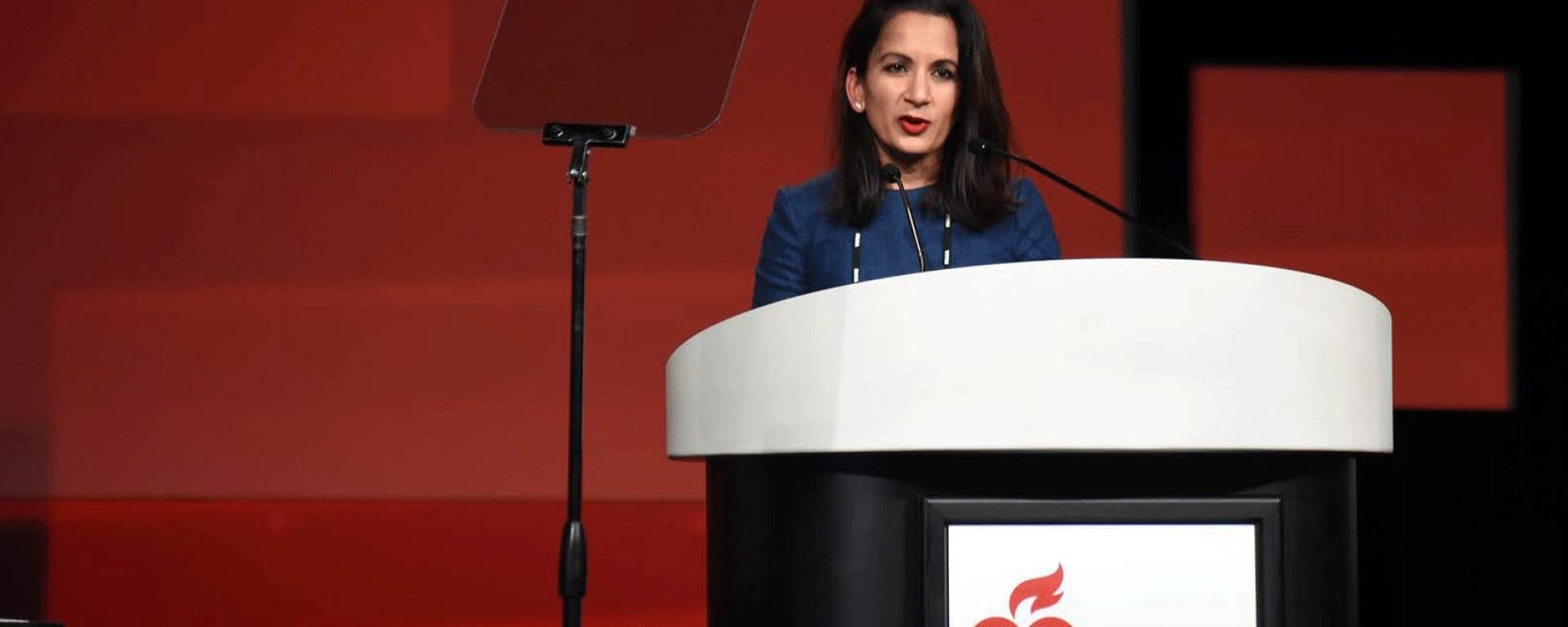 person speaking at a podium