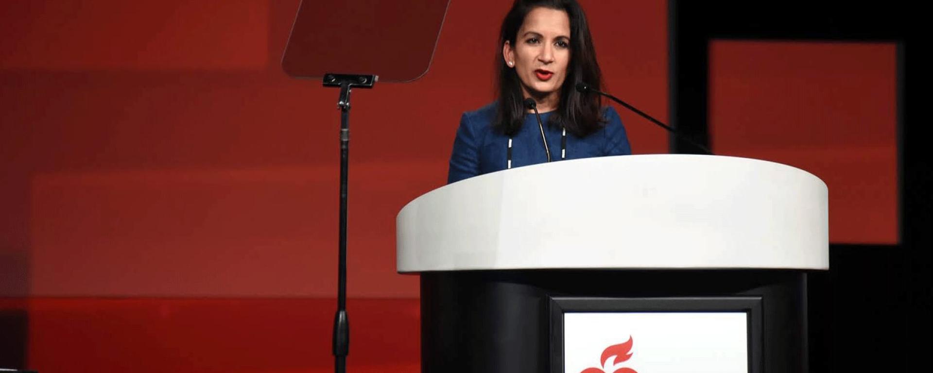 person speaking at a podium