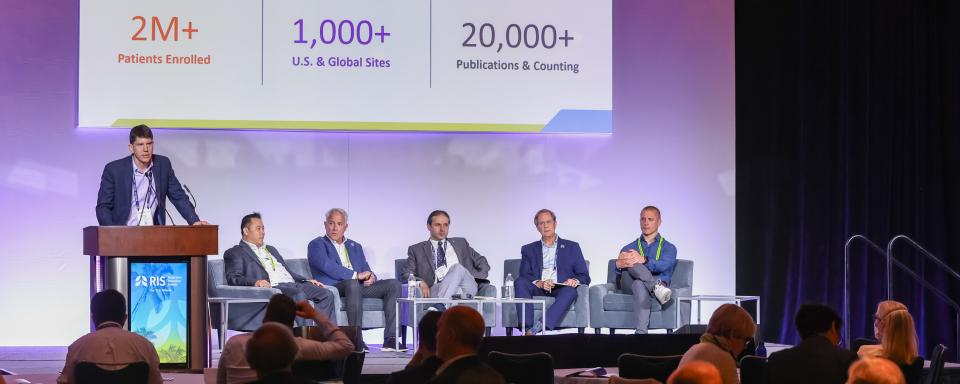 DCRI's Scott Palmer stands at a podium at the American Thoracic Society Conference in 2026 as part of a panel discussion.